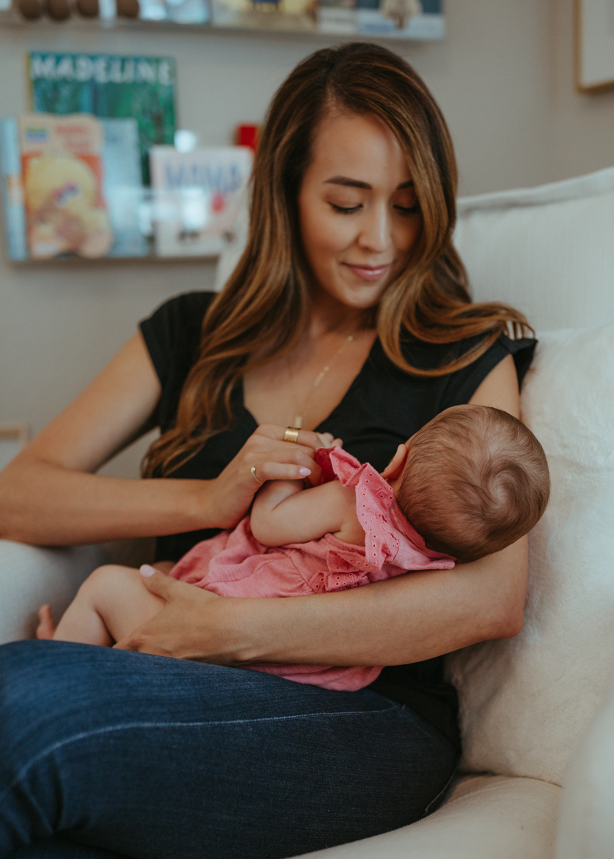 mother breastfeeding child, clogged milk ducts